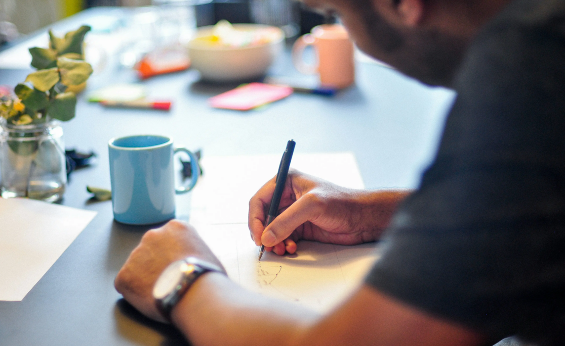 person writing notes